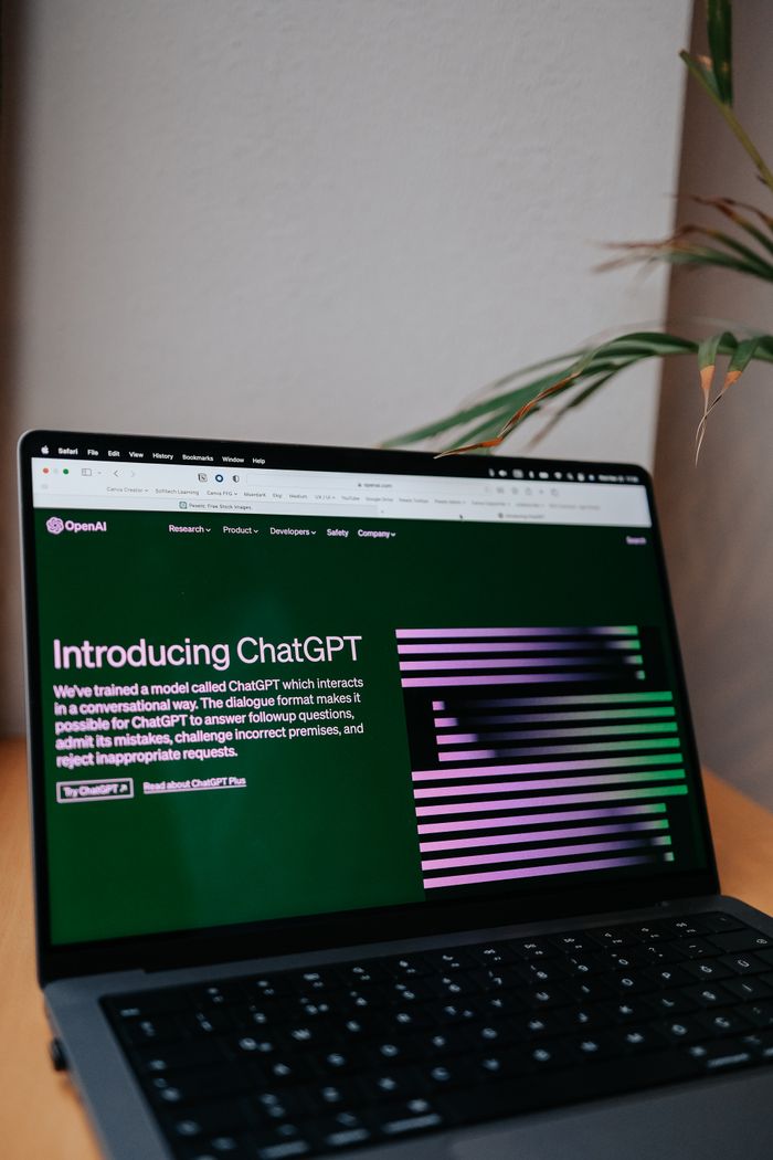 hero-img-01 OpenAI ChatGPT introduction on a laptop screen with focus on new AI features.